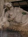 One of the figures at an intersection with a fountain on each corner.